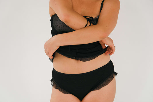 Merino wool and tulle panties Ralli on a model, showcasing the warm and stylish design with delicate tulle ruffle detail.