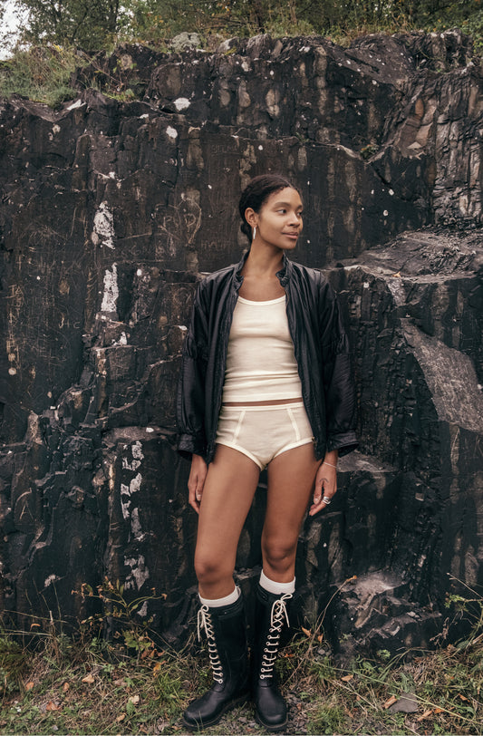 Merino wool top in beige, showcasing casual style and comfort, perfect for everyday wear.