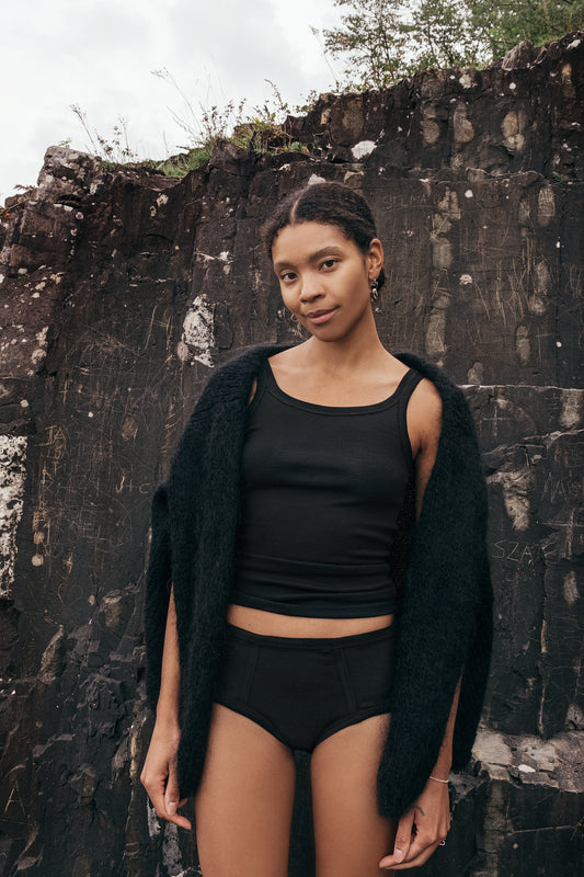 Merino wool panties on a model showcasing comfort and style in a natural setting.